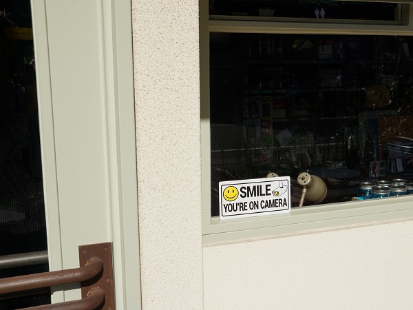 SMILE YOU'RE ON CAMERA SIGN