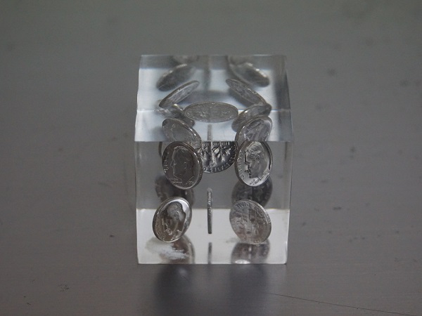 VINTAGE ONE DIME PAPER WEIGHT